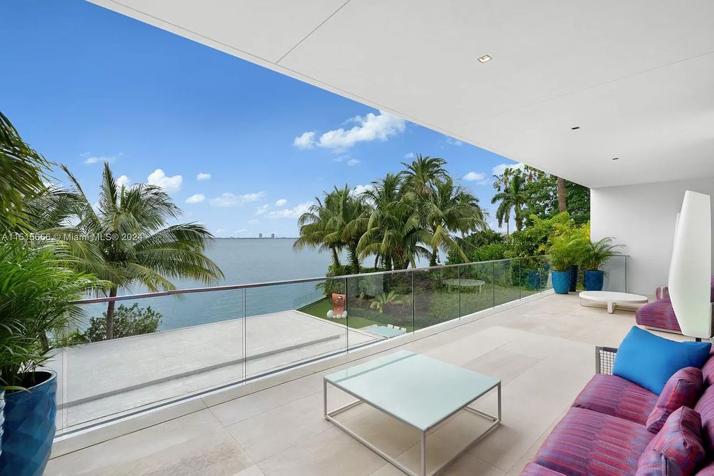 Discover elegance in this $42.5 million contemporary masterpiece by Jennifer Post on North Bay Road, Miami Beach. Atrium courtyard, infinity edge pool, rooftop pool, and a private dock with 105 feet of water frontage offer luxury living with breathtaking views.