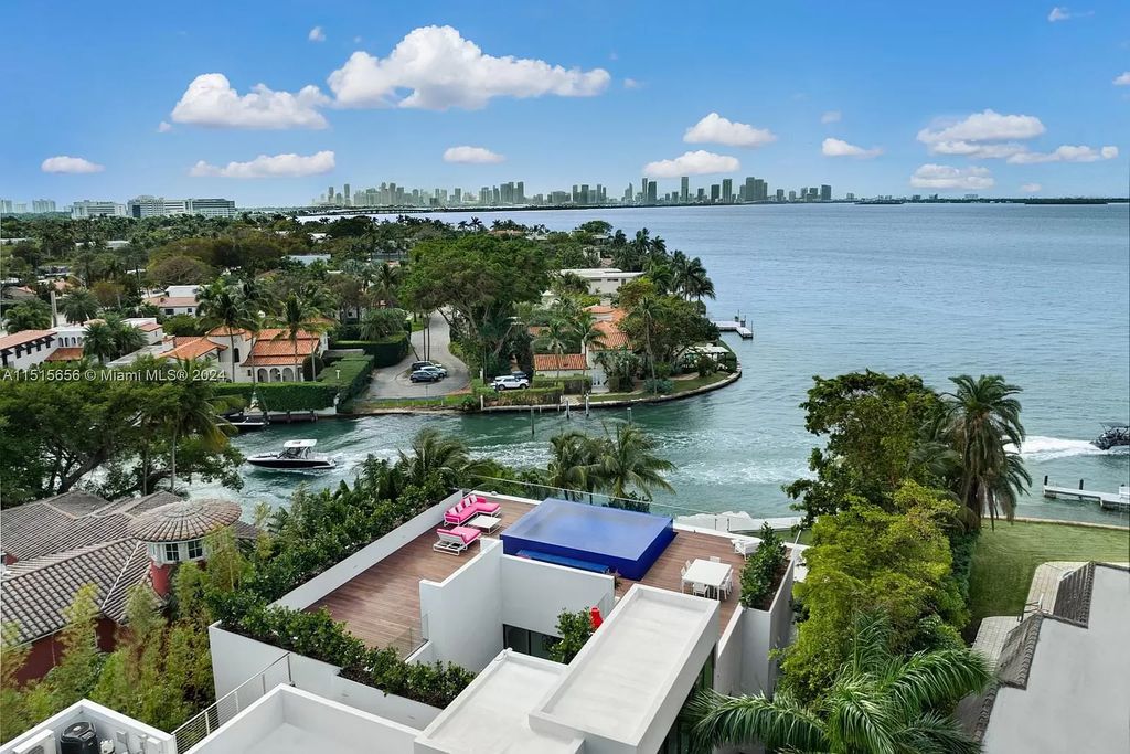 Discover elegance in this $42.5 million contemporary masterpiece by Jennifer Post on North Bay Road, Miami Beach. Atrium courtyard, infinity edge pool, rooftop pool, and a private dock with 105 feet of water frontage offer luxury living with breathtaking views.