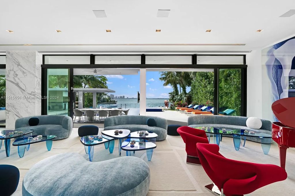 Discover elegance in this $42.5 million contemporary masterpiece by Jennifer Post on North Bay Road, Miami Beach. Atrium courtyard, infinity edge pool, rooftop pool, and a private dock with 105 feet of water frontage offer luxury living with breathtaking views.