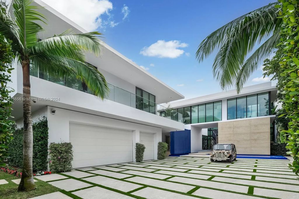 Discover elegance in this $42.5 million contemporary masterpiece by Jennifer Post on North Bay Road, Miami Beach. Atrium courtyard, infinity edge pool, rooftop pool, and a private dock with 105 feet of water frontage offer luxury living with breathtaking views.