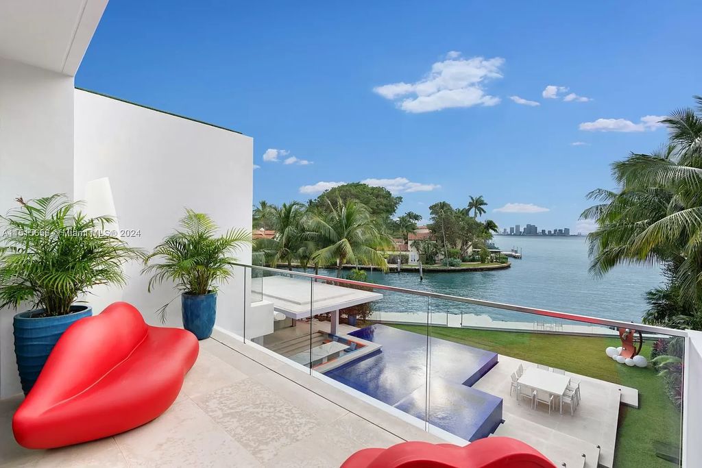 Discover elegance in this $42.5 million contemporary masterpiece by Jennifer Post on North Bay Road, Miami Beach. Atrium courtyard, infinity edge pool, rooftop pool, and a private dock with 105 feet of water frontage offer luxury living with breathtaking views.