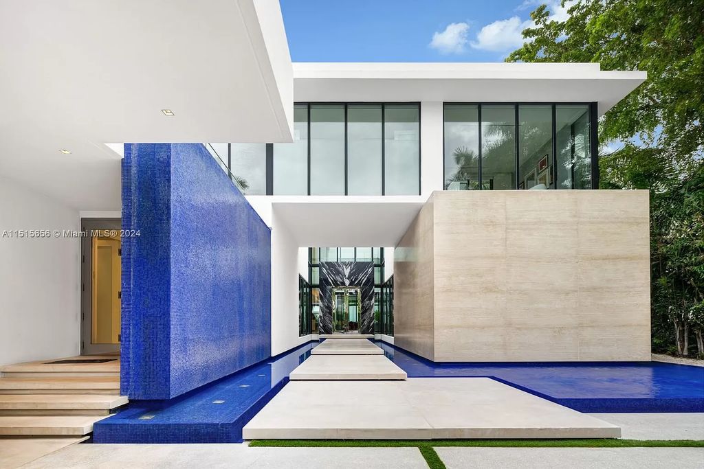 Discover elegance in this $42.5 million contemporary masterpiece by Jennifer Post on North Bay Road, Miami Beach. Atrium courtyard, infinity edge pool, rooftop pool, and a private dock with 105 feet of water frontage offer luxury living with breathtaking views.