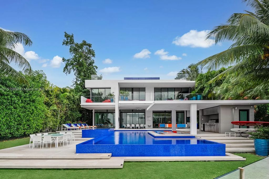 Discover elegance in this $42.5 million contemporary masterpiece by Jennifer Post on North Bay Road, Miami Beach. Atrium courtyard, infinity edge pool, rooftop pool, and a private dock with 105 feet of water frontage offer luxury living with breathtaking views.