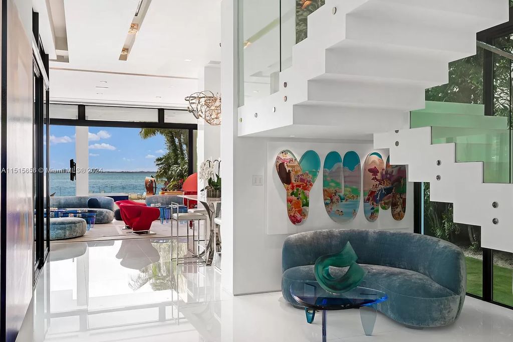 Discover elegance in this $42.5 million contemporary masterpiece by Jennifer Post on North Bay Road, Miami Beach. Atrium courtyard, infinity edge pool, rooftop pool, and a private dock with 105 feet of water frontage offer luxury living with breathtaking views.