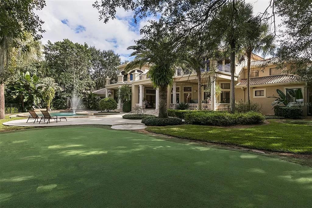 Unwind in this expansive 6,100+ square feet estate overlooking Isleworth's championship golf course. Custom details, a private pool and panoramic views await. 5 bedrooms, bonus room and stunning outdoor living.