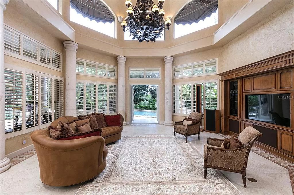 Unwind in this expansive 6,100+ square feet estate overlooking Isleworth's championship golf course. Custom details, a private pool and panoramic views await. 5 bedrooms, bonus room and stunning outdoor living.