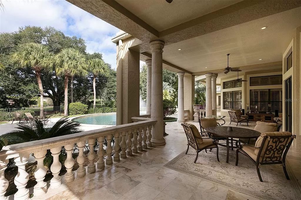 Unwind in this expansive 6,100+ square feet estate overlooking Isleworth's championship golf course. Custom details, a private pool and panoramic views await. 5 bedrooms, bonus room and stunning outdoor living.