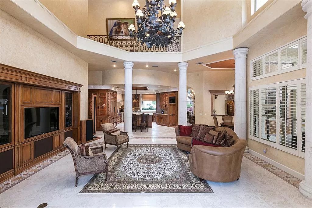 Unwind in this expansive 6,100+ square feet estate overlooking Isleworth's championship golf course. Custom details, a private pool and panoramic views await. 5 bedrooms, bonus room and stunning outdoor living.