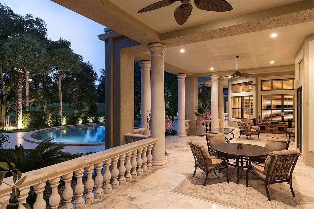 Unwind in this expansive 6,100+ square feet estate overlooking Isleworth's championship golf course. Custom details, a private pool and panoramic views await. 5 bedrooms, bonus room and stunning outdoor living.