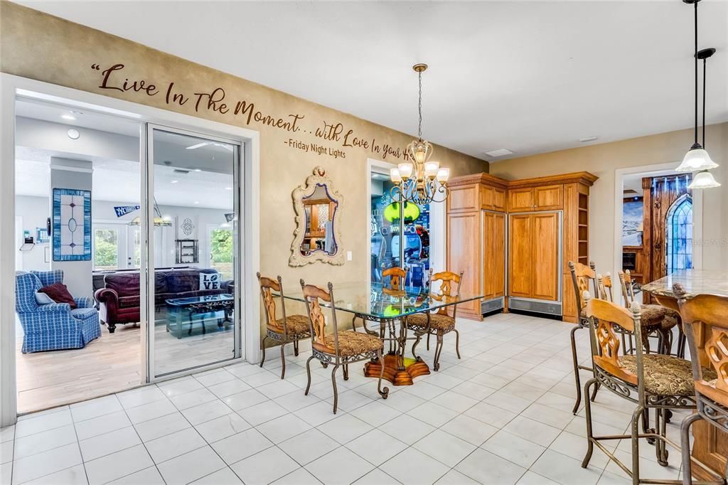 Escape to your own 54-acre playground! Fully furnished, income-generating Clermont Chain lakefront estate boasts 12 bedrooms, 3 kitchens, game rooms, arcade, pool and endless lake activities.