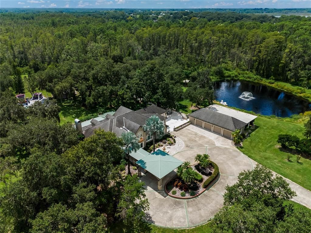 Escape to your own 54-acre playground! Fully furnished, income-generating Clermont Chain lakefront estate boasts 12 bedrooms, 3 kitchens, game rooms, arcade, pool and endless lake activities.