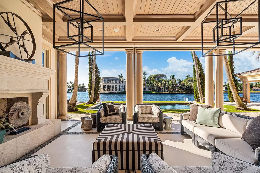 Gated Boca Raton estate with breathtaking Intracoastal and Royal Palm Grand Canal views. Tropical Georgian design with grand living spaces, gourmet kitchen, luxurious primary suite and resort-style pool/patio.