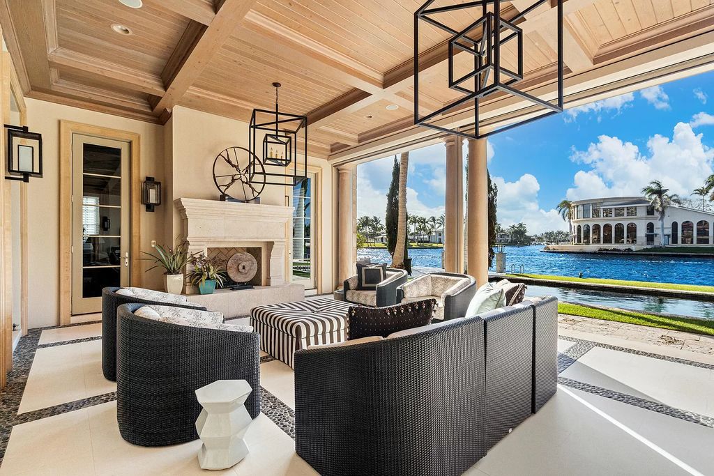 Gated Boca Raton estate with breathtaking Intracoastal and Royal Palm Grand Canal views. Tropical Georgian design with grand living spaces, gourmet kitchen, luxurious primary suite and resort-style pool/patio.