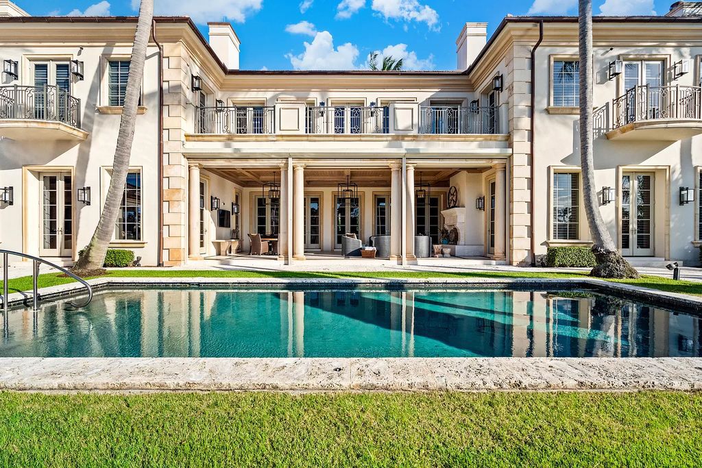 Gated Boca Raton estate with breathtaking Intracoastal and Royal Palm Grand Canal views. Tropical Georgian design with grand living spaces, gourmet kitchen, luxurious primary suite and resort-style pool/patio.