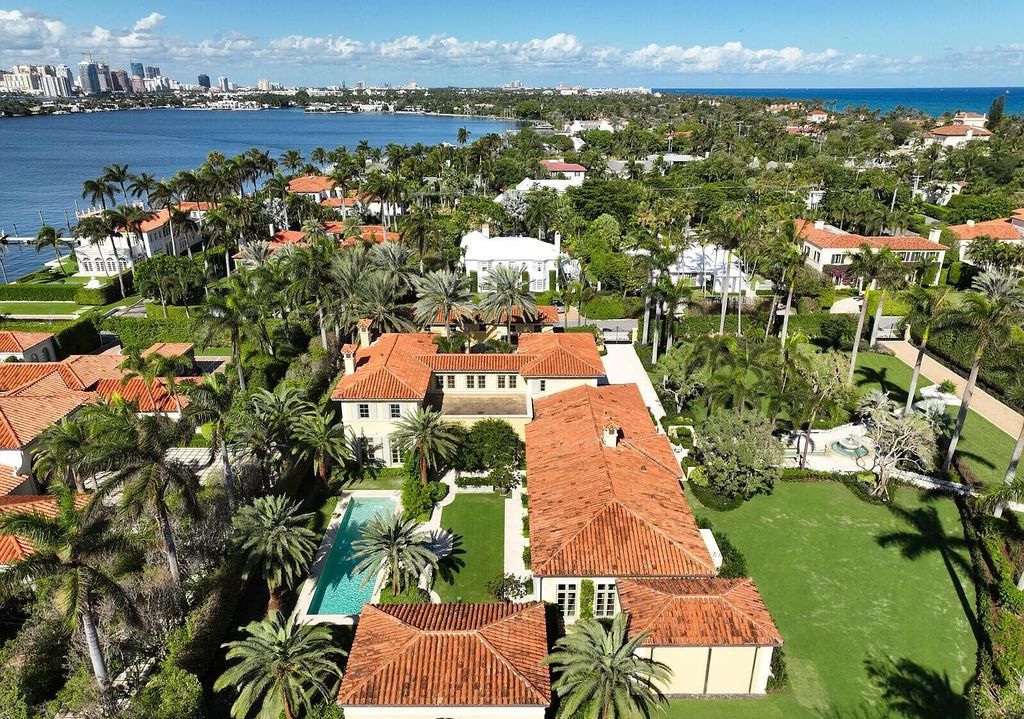 Escape to paradise at 160 Clarendon Ave. This meticulously crafted 5-bed, 6.5-bath estate exudes timeless elegance with its Mediterranean architecture, expansive living spaces, and private pool and spa. Find your sanctuary on 1.47 acres of Palm Beach bliss.