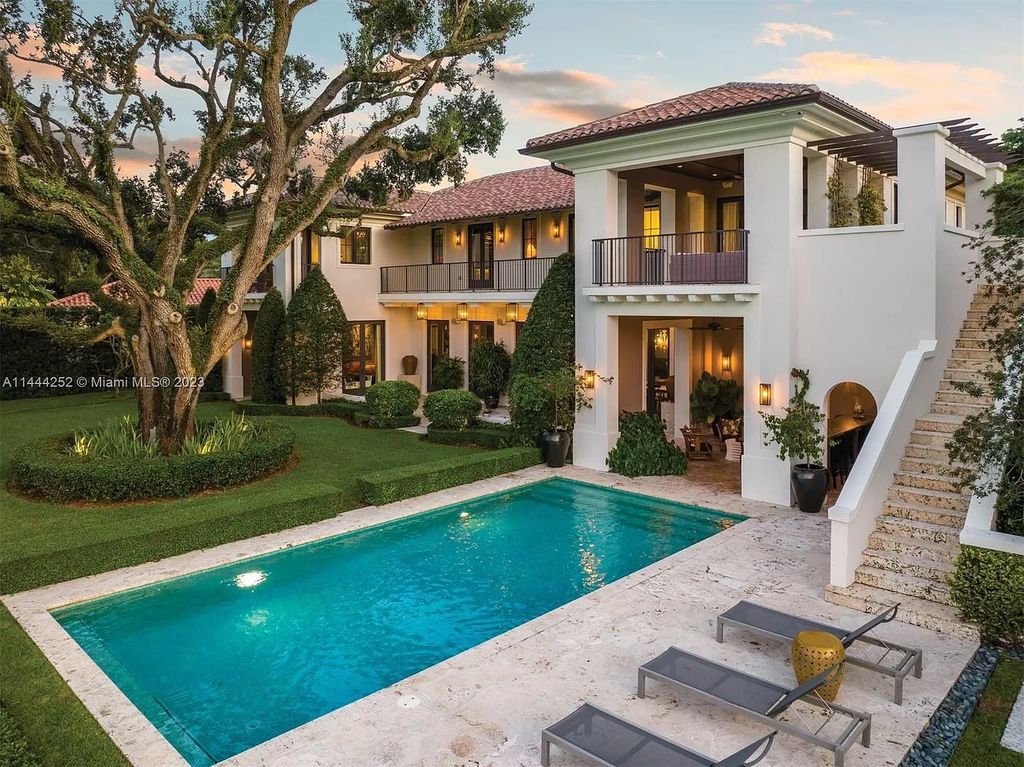 Experience unparalleled luxury in this meticulously designed 6-bedroom estate, boasting stunning golf course vistas, a chef's kitchen, resort-style pool, and prime location near Miami attractions.