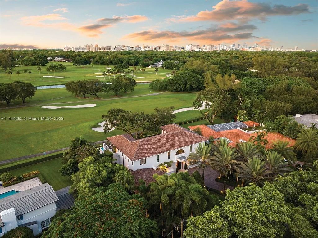 Experience unparalleled luxury in this meticulously designed 6-bedroom estate, boasting stunning golf course vistas, a chef's kitchen, resort-style pool, and prime location near Miami attractions.