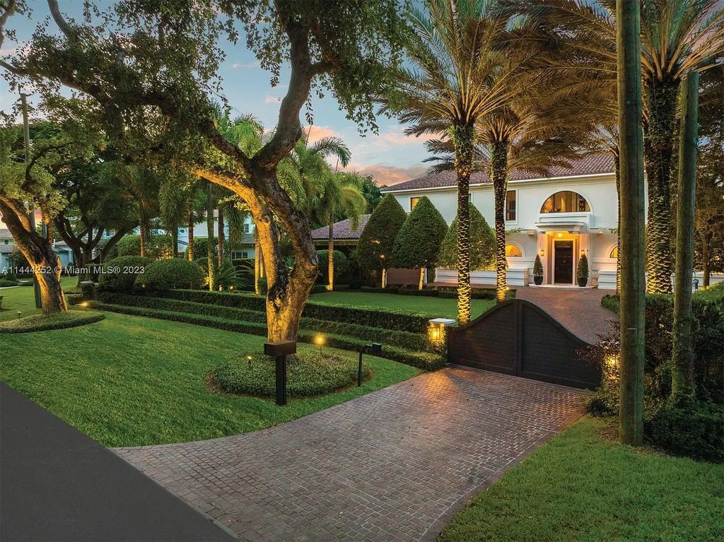 Experience unparalleled luxury in this meticulously designed 6-bedroom estate, boasting stunning golf course vistas, a chef's kitchen, resort-style pool, and prime location near Miami attractions.