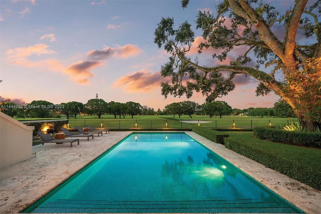 Experience unparalleled luxury in this meticulously designed 6-bedroom estate, boasting stunning golf course vistas, a chef's kitchen, resort-style pool, and prime location near Miami attractions.