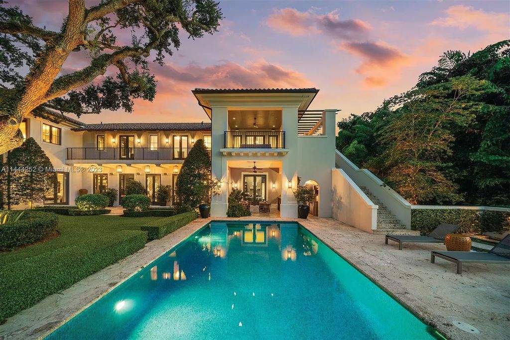 Experience unparalleled luxury in this meticulously designed 6-bedroom estate, boasting stunning golf course vistas, a chef's kitchen, resort-style pool, and prime location near Miami attractions.