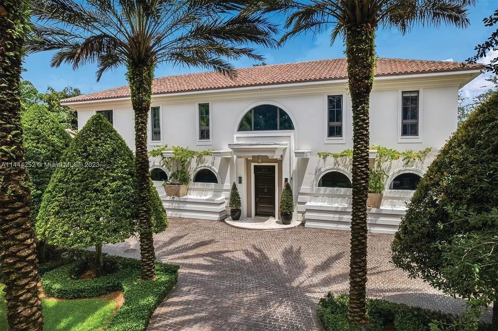 Experience unparalleled luxury in this meticulously designed 6-bedroom estate, boasting stunning golf course vistas, a chef's kitchen, resort-style pool, and prime location near Miami attractions.