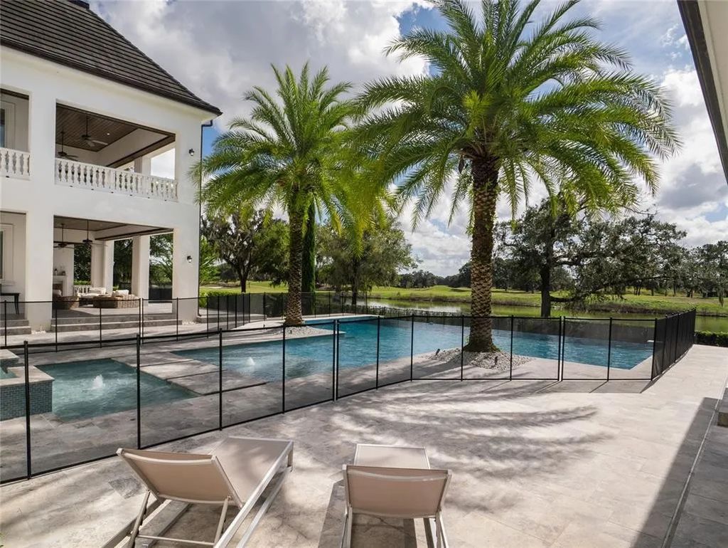 Live like royalty in this magnificent estate at Golden Ocala! Equestrian center access, 7 fireplaces, 2 master suites, gourmet kitchen, home theater, infinity pool & more. Schedule your private showing today!