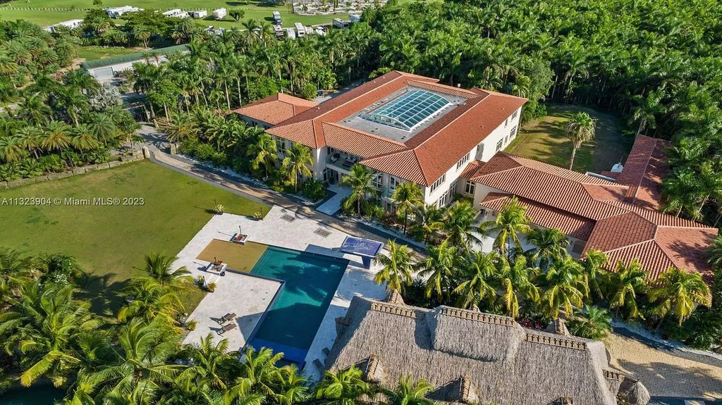 Own a piece of Miami paradise! This one-of-a-kind estate exudes opulence with 33,000+ sq ft, 10+ bedrooms, and 18 private acres.