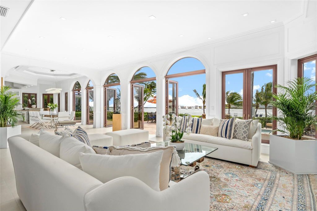 Wake up to mesmerizing ocean panoramas in this custom-built masterpiece. Graciously perched on the Port Everglades Ship Channel, this estate offers opulent living, endless entertainment, and the ultimate waterfront lifestyle.