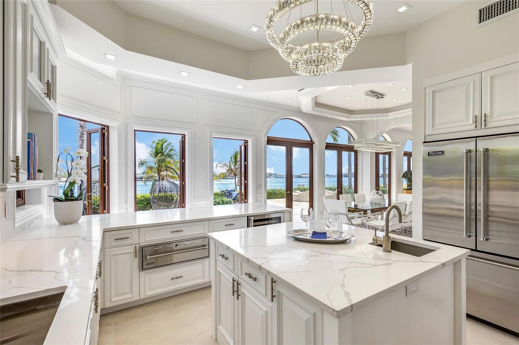 Wake up to mesmerizing ocean panoramas in this custom-built masterpiece. Graciously perched on the Port Everglades Ship Channel, this estate offers opulent living, endless entertainment, and the ultimate waterfront lifestyle.