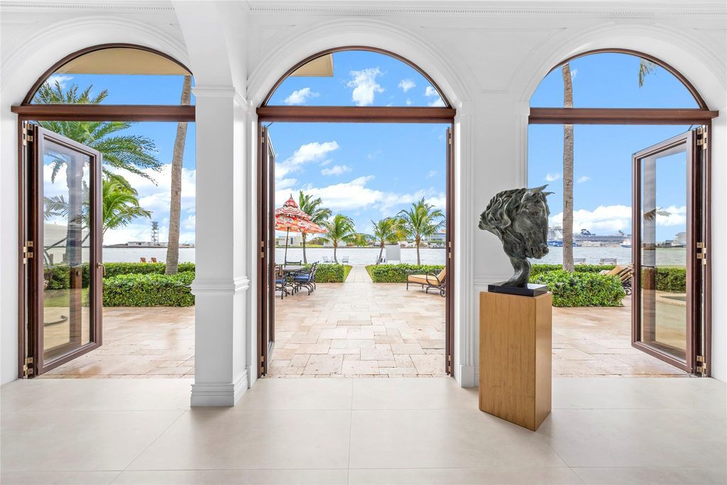 Wake up to mesmerizing ocean panoramas in this custom-built masterpiece. Graciously perched on the Port Everglades Ship Channel, this estate offers opulent living, endless entertainment, and the ultimate waterfront lifestyle.