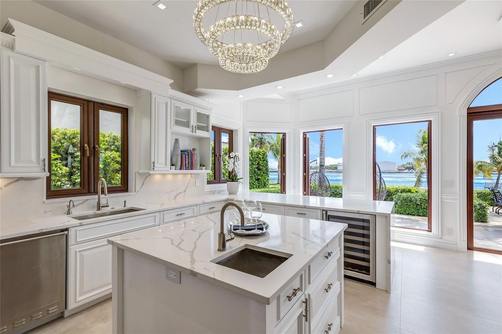 Wake up to mesmerizing ocean panoramas in this custom-built masterpiece. Graciously perched on the Port Everglades Ship Channel, this estate offers opulent living, endless entertainment, and the ultimate waterfront lifestyle.