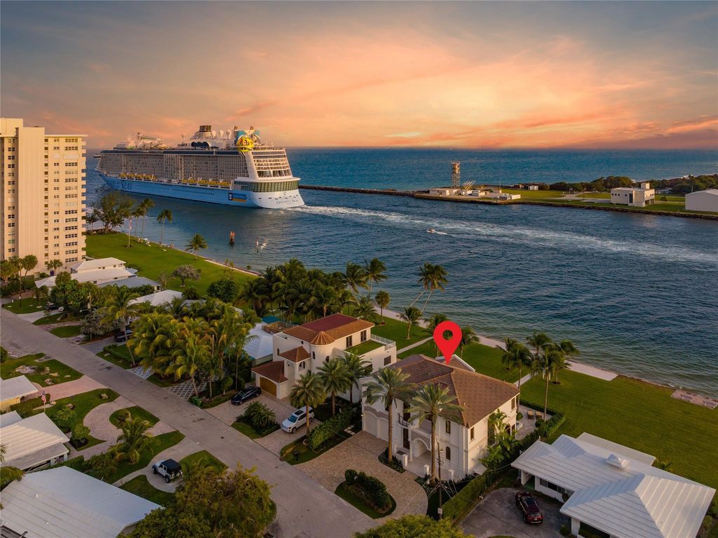 Wake up to mesmerizing ocean panoramas in this custom-built masterpiece. Graciously perched on the Port Everglades Ship Channel, this estate offers opulent living, endless entertainment, and the ultimate waterfront lifestyle.