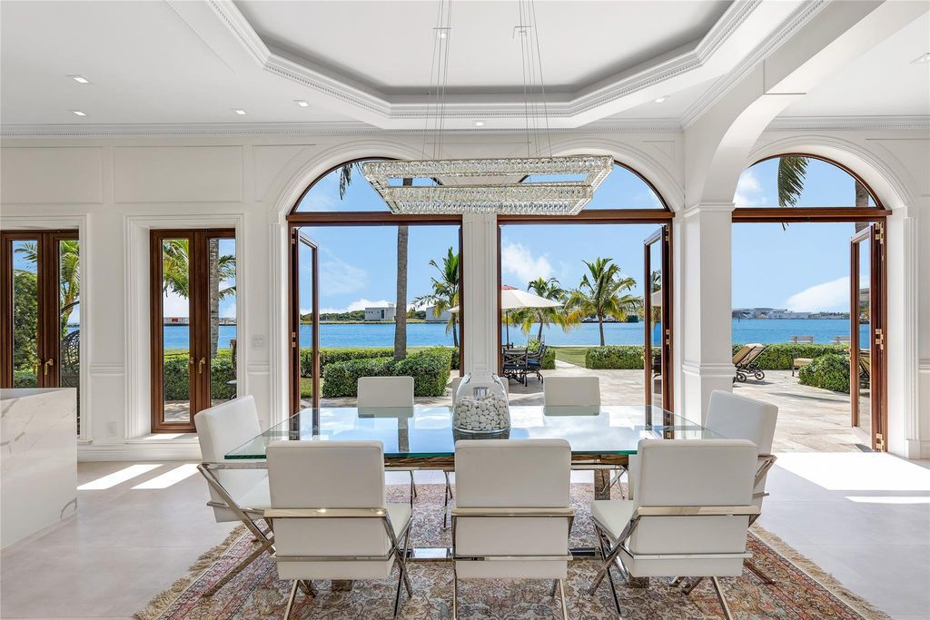 Wake up to mesmerizing ocean panoramas in this custom-built masterpiece. Graciously perched on the Port Everglades Ship Channel, this estate offers opulent living, endless entertainment, and the ultimate waterfront lifestyle.