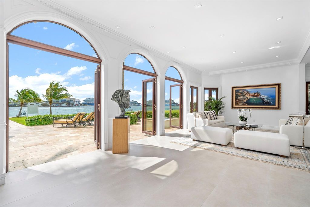 Wake up to mesmerizing ocean panoramas in this custom-built masterpiece. Graciously perched on the Port Everglades Ship Channel, this estate offers opulent living, endless entertainment, and the ultimate waterfront lifestyle.