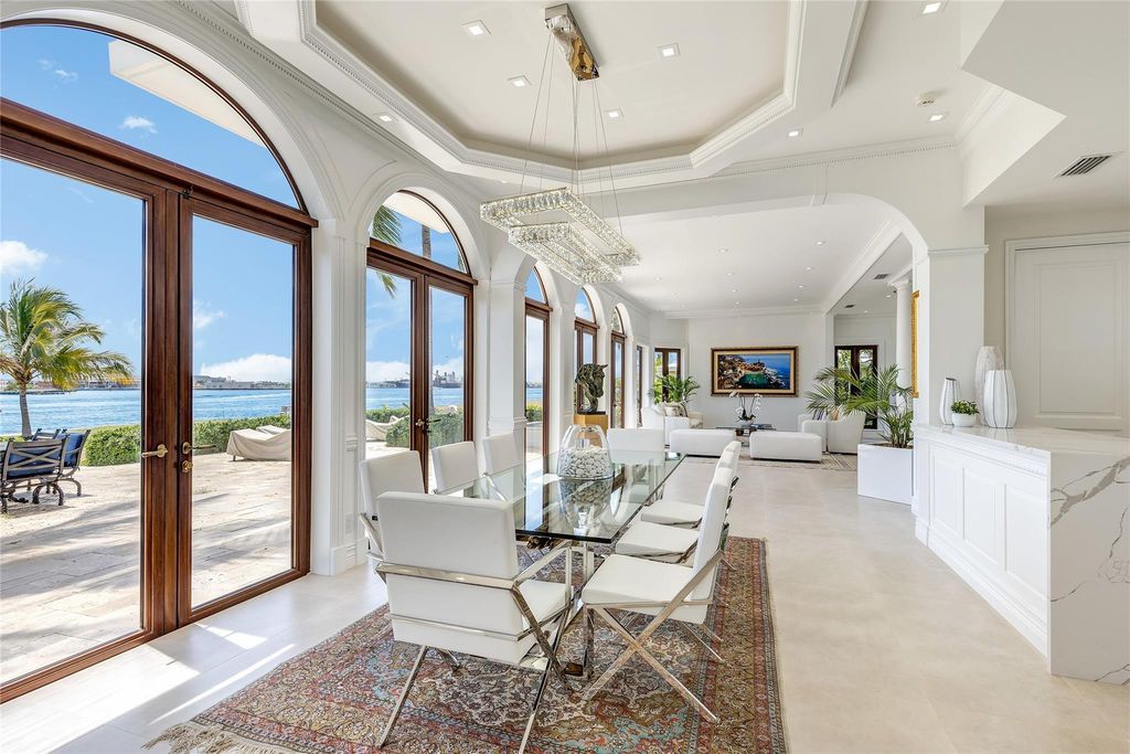 Wake up to mesmerizing ocean panoramas in this custom-built masterpiece. Graciously perched on the Port Everglades Ship Channel, this estate offers opulent living, endless entertainment, and the ultimate waterfront lifestyle.