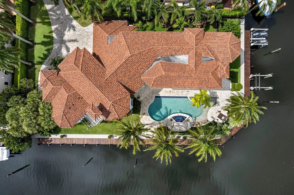 Experience the epitome of luxury waterfront living in this grand 5BR estate. Situated on an oversized lot in the prestigious Harbour Isles community, this home boasts over 10,000 sqft of living space, private preserve views, and a deep-water dock.