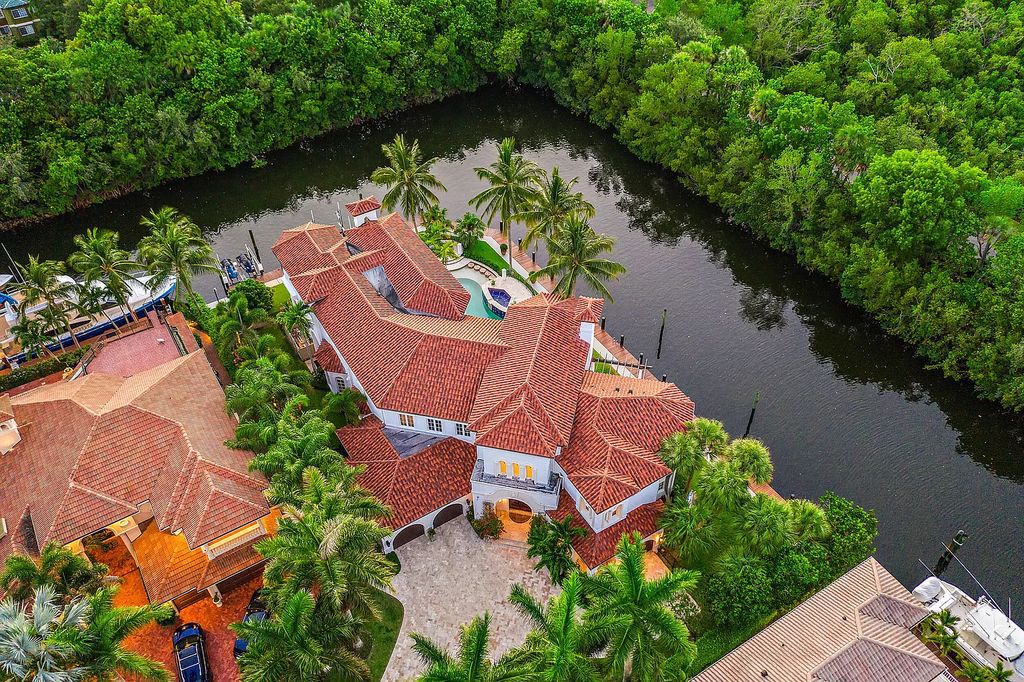 Experience the epitome of luxury waterfront living in this grand 5BR estate. Situated on an oversized lot in the prestigious Harbour Isles community, this home boasts over 10,000 sqft of living space, private preserve views, and a deep-water dock.