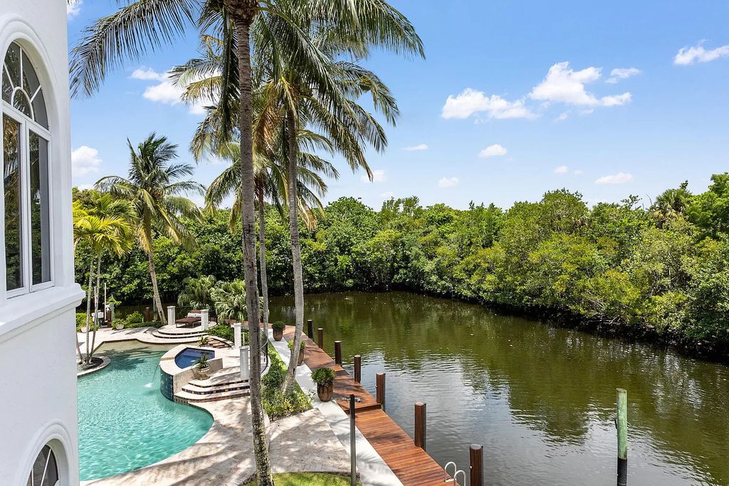 Experience the epitome of luxury waterfront living in this grand 5BR estate. Situated on an oversized lot in the prestigious Harbour Isles community, this home boasts over 10,000 sqft of living space, private preserve views, and a deep-water dock.