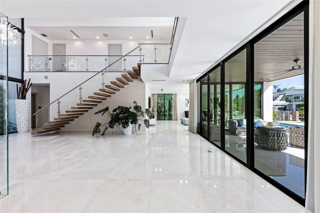 Unparalleled luxury awaits in this newer custom Las Olas Isles stunner. Exquisite contemporary architecture, 25ft ceilings and seamless indoor/outdoor living. Poggenpohl kitchen, wine cellar, media room/gym and 6 ensuite bedrooms. Resort-style pool, dock and city utilities. Jeff Hendricks masterpiece.