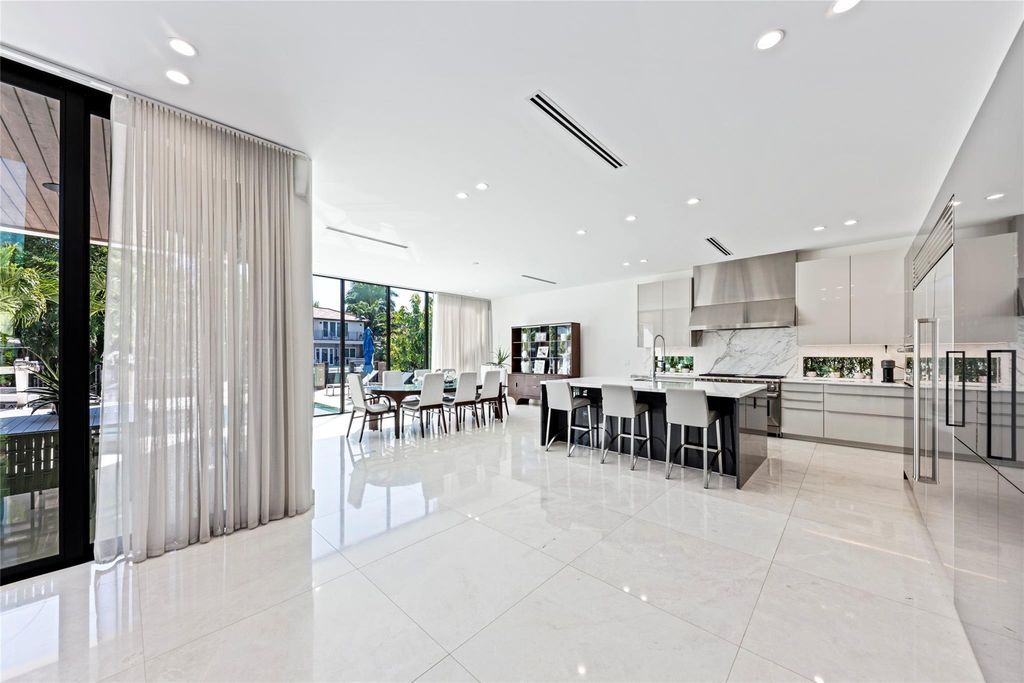 Unparalleled luxury awaits in this newer custom Las Olas Isles stunner. Exquisite contemporary architecture, 25ft ceilings and seamless indoor/outdoor living. Poggenpohl kitchen, wine cellar, media room/gym and 6 ensuite bedrooms. Resort-style pool, dock and city utilities. Jeff Hendricks masterpiece.