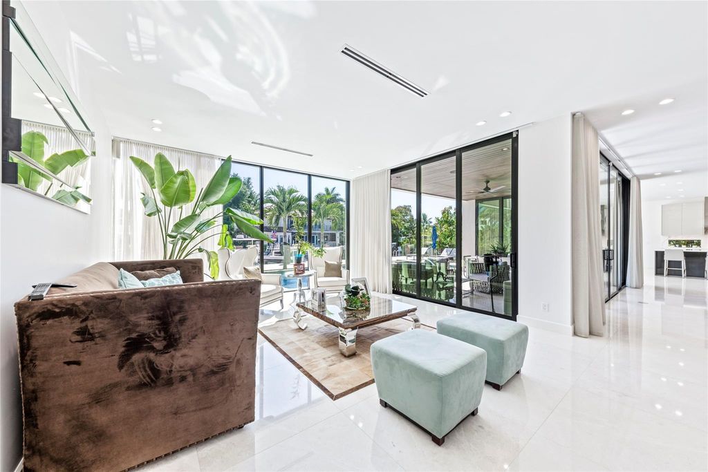 Unparalleled luxury awaits in this newer custom Las Olas Isles stunner. Exquisite contemporary architecture, 25ft ceilings and seamless indoor/outdoor living. Poggenpohl kitchen, wine cellar, media room/gym and 6 ensuite bedrooms. Resort-style pool, dock and city utilities. Jeff Hendricks masterpiece.