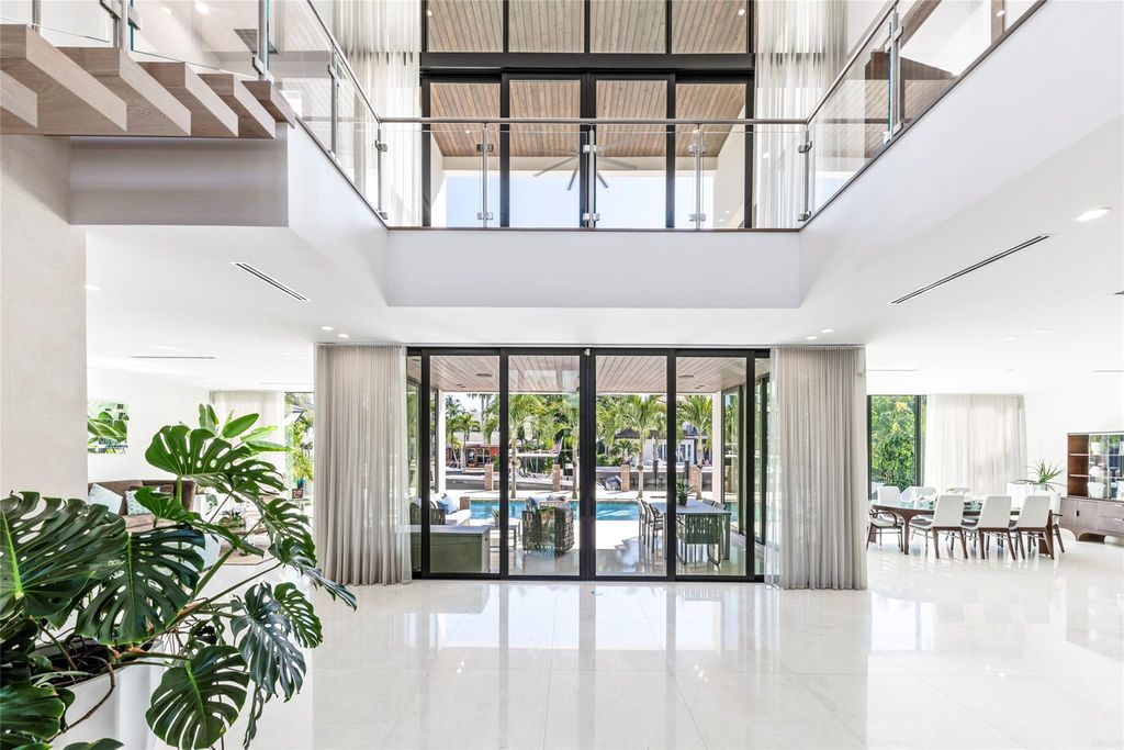 Unparalleled luxury awaits in this newer custom Las Olas Isles stunner. Exquisite contemporary architecture, 25ft ceilings and seamless indoor/outdoor living. Poggenpohl kitchen, wine cellar, media room/gym and 6 ensuite bedrooms. Resort-style pool, dock and city utilities. Jeff Hendricks masterpiece.