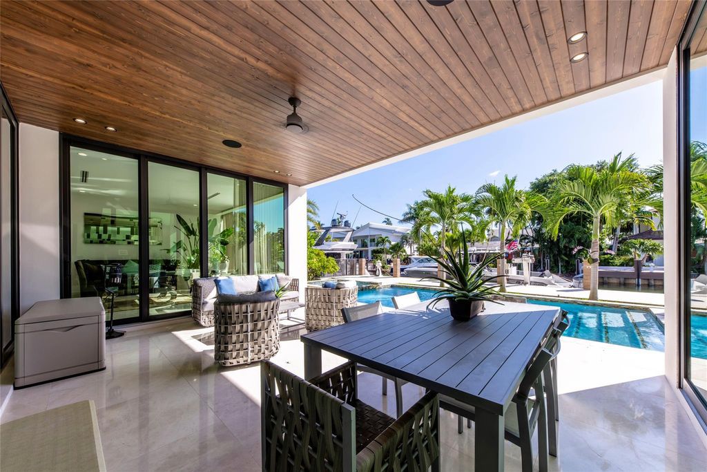 Unparalleled luxury awaits in this newer custom Las Olas Isles stunner. Exquisite contemporary architecture, 25ft ceilings and seamless indoor/outdoor living. Poggenpohl kitchen, wine cellar, media room/gym and 6 ensuite bedrooms. Resort-style pool, dock and city utilities. Jeff Hendricks masterpiece.