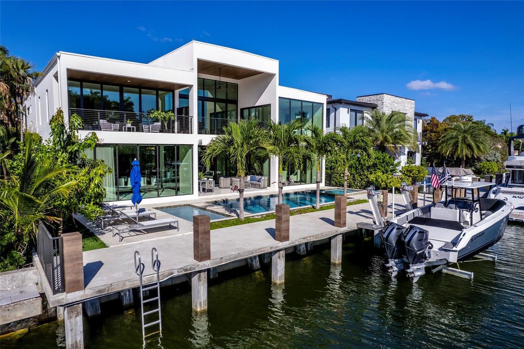 Unparalleled luxury awaits in this newer custom Las Olas Isles stunner. Exquisite contemporary architecture, 25ft ceilings and seamless indoor/outdoor living. Poggenpohl kitchen, wine cellar, media room/gym and 6 ensuite bedrooms. Resort-style pool, dock and city utilities. Jeff Hendricks masterpiece.