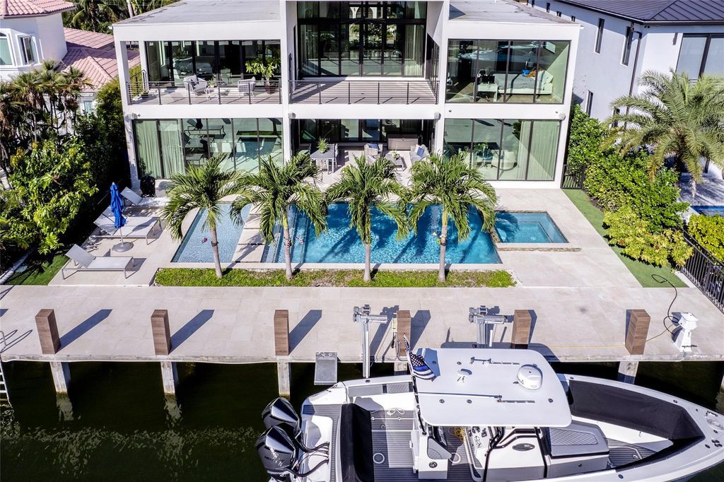 Unparalleled luxury awaits in this newer custom Las Olas Isles stunner. Exquisite contemporary architecture, 25ft ceilings and seamless indoor/outdoor living. Poggenpohl kitchen, wine cellar, media room/gym and 6 ensuite bedrooms. Resort-style pool, dock and city utilities. Jeff Hendricks masterpiece.