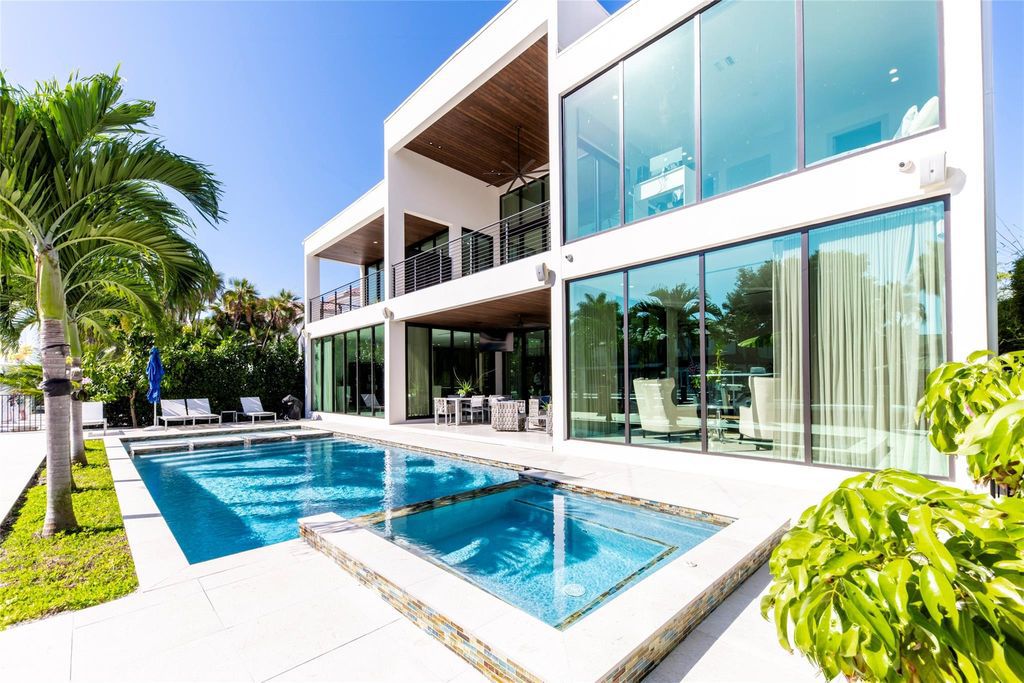 Unparalleled luxury awaits in this newer custom Las Olas Isles stunner. Exquisite contemporary architecture, 25ft ceilings and seamless indoor/outdoor living. Poggenpohl kitchen, wine cellar, media room/gym and 6 ensuite bedrooms. Resort-style pool, dock and city utilities. Jeff Hendricks masterpiece.