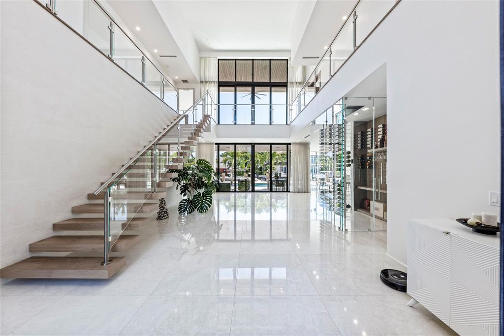 Unparalleled luxury awaits in this newer custom Las Olas Isles stunner. Exquisite contemporary architecture, 25ft ceilings and seamless indoor/outdoor living. Poggenpohl kitchen, wine cellar, media room/gym and 6 ensuite bedrooms. Resort-style pool, dock and city utilities. Jeff Hendricks masterpiece.