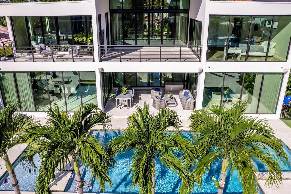 Unparalleled luxury awaits in this newer custom Las Olas Isles stunner. Exquisite contemporary architecture, 25ft ceilings and seamless indoor/outdoor living. Poggenpohl kitchen, wine cellar, media room/gym and 6 ensuite bedrooms. Resort-style pool, dock and city utilities. Jeff Hendricks masterpiece.