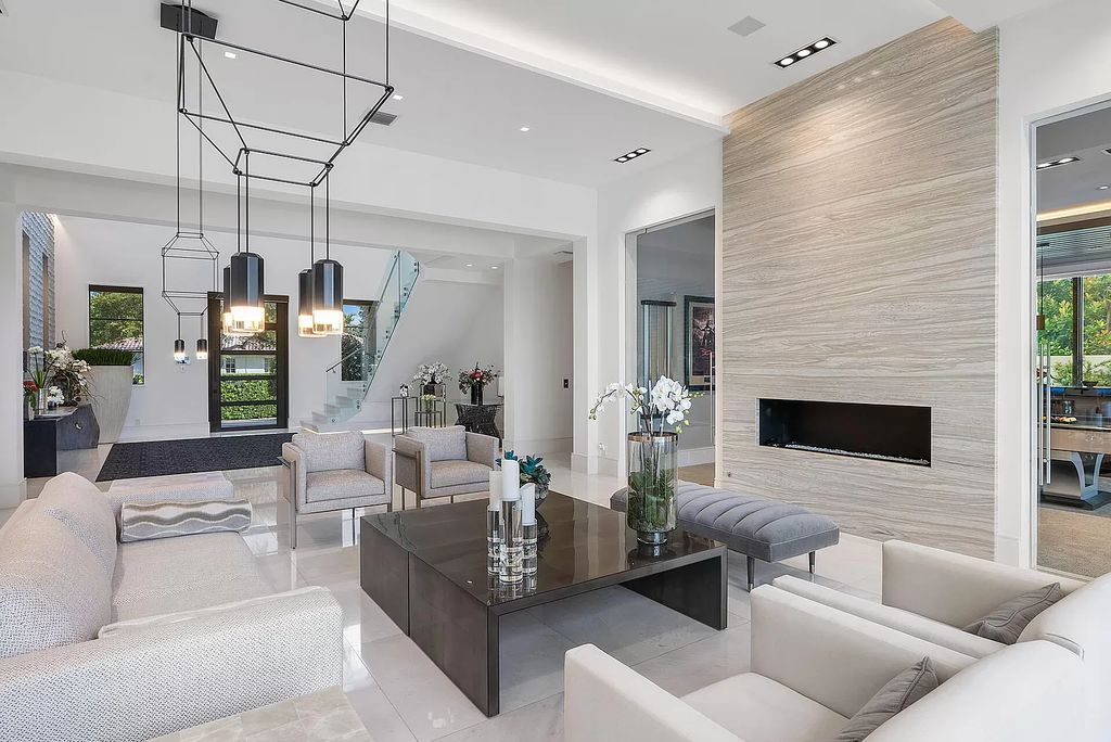 Unparalleled luxury awaits at 290 South Maya Palm Drive: 5 bedrooms, 6.2 baths, 9,000+ sqft of coastal-glam living with 140' waterfront, infinity pool and resort-style backyard. Agate walls, marble fireplaces and designer details. Boca Raton living redefined.