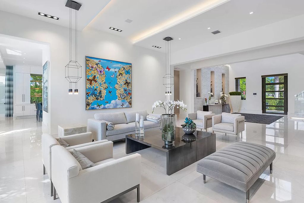 Unparalleled luxury awaits at 290 South Maya Palm Drive: 5 bedrooms, 6.2 baths, 9,000+ sqft of coastal-glam living with 140' waterfront, infinity pool and resort-style backyard. Agate walls, marble fireplaces and designer details. Boca Raton living redefined.